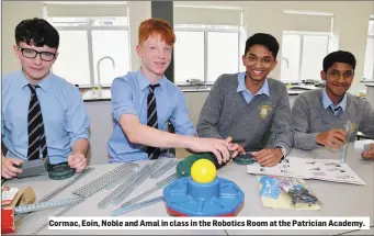  ??  ?? Cormac, Eoin, Noble and Amal in class in the Robotics Room at the Patrician Academy.