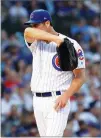  ?? AP PHOTO BY NAM Y. HUH ?? Chicago Cubs starting pitcher Cole Hamels wipes his face during the second inning of a baseball game against the Washington Nationals, Sunday, Aug. 12 in Chicago.