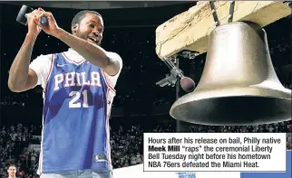  ??  ?? Hours after his release on bail, Philly native
Meek Mill “raps” the ceremonial Liberty Bell Tuesday night before his hometown NBA 76ers defeated the Miami Heat.
