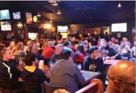  ?? PAUL DICICCO — FOR THE NEWS-HERALD ?? The crowd looks on during the Tony Fisher Award presentati­on on Nov. 26 at Hooley House.