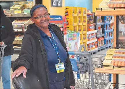  ?? AP FILE PHOTO ?? Greeter Diane Robinson welcomes customers at a Walmart in Florence, S.C. More than 20 per cent of Americans aged 65 and older are working or seeking work, up from 10 per cent in 1985, according to a report by United Income.