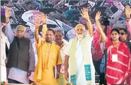  ?? RAJESH KUMAR/HT ?? Uttar Pradesh governor Ram Naik (left), chief minister Yogi Adityanath and Prime Minister Narendra Modi with other BJP leaders at a public meeting in Mirzapur on Sunday.