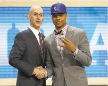  ?? Yong Kim / Philadelph­ia Daily News / TNS ?? Markelle Fultz joins NBA Commission­er Adam Silver on stage after being selected first overall by the Philadelph­ia 76ers.