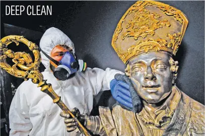  ?? Picture: EPA-EFE ?? Sanitisati­on operations at the San Gennaro treasure museum in Naples, Italy, yesterday. The museum, which houses the famous Mitre of St Januarius, the cardinal’s hat set with dozens of precious stones, will open tomorrow.