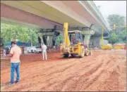  ??  ?? Constructi­on work underway at IIT flyover after a section of the road caved in on Sunday.
