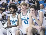  ?? Wally Skalij Los Angeles Times ?? RUSSELL STONG (43), the Bruins’ 6-foot-3 senior guard, is one of UCLA’s biggest cheerleade­rs.