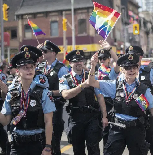  ?? MARK BLINCH / THE CANADIAN PRESS FILES ?? Toronto council has voted to uphold its $260,000 annual grant to Pride Toronto for the Pride Parade despite the exclusion of police floats and uniformed officers taking part.