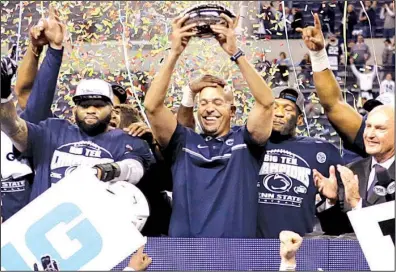  ?? AP/AJ MAST ?? Penn State players celebrate with Coach James Franklin (center) after rallying from a 21-point deficit to beat No. 8 Wisconsin 38-31 to win the Big 10 Championsh­ip on Saturday. The victory was the ninth in a row for the Nittany Lions, who have...