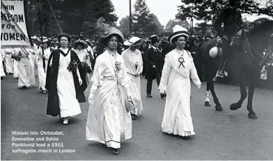  ??  ?? Historic trio: Christabel, Emmeline and Sylvia Pankhurst lead a 1911 suffragett­e march in London