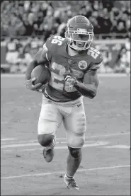  ?? AP/CHARLIE RIEDEL ?? Kansas City running back Damien Williams (26) scored two touchdowns in the Chiefs’ 27-24 overtime victory over the Baltimore Ravens on Sunday.