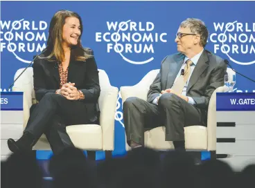  ?? FABRICE COFFRINI / AFP VIA GETTY IMAGES FILES ?? What was announced as an amicable split between Melinda and Bill Gates, above at the 2015 Davos summit, appears to be increasing­ly more acrimoniou­s.