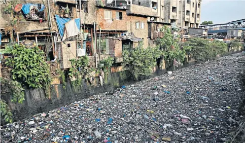  ??  ?? The day before World Environmen­t Day, this was the scene in Mumbai, India, with plastic waste choking a canal
