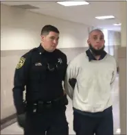  ?? CARL HESSLER JR. — MEDIANEWS GROUP ?? Stephen Thomas Anderer, 35, of Philadelph­ia, is escorted from a Montgomery County courtroom after he was sentenced to 29½ to 59 years in prison for robbing three businesses in Upper Moreland and Upper Dublin townships between September and October 2017.