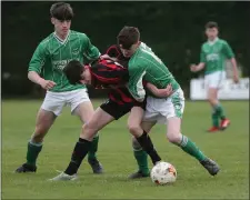  ??  ?? Darragh Levingston­e of Gorey Rangers is flanked by Forth Celtic duo Kevin Breen and Conor Stafford.