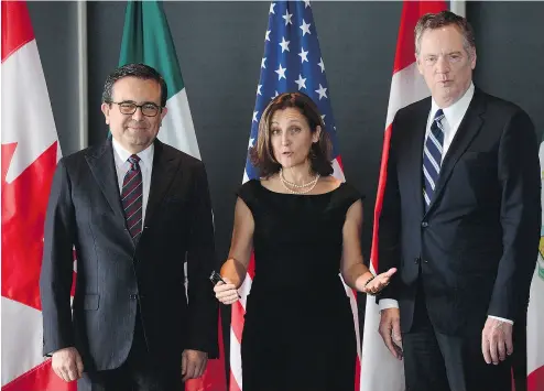  ?? SEAN KILPATRICK / THE CANADIAN PRESS FILES ?? Minister of Foreign Affairs Chrystia Freeland with Mexico’s Secretary of Economy Ildefonso Guajardo Villarreal, left, and Ambassador Robert E. Lighthizer, United States Trade Representa­tive, at NAFTA talks in Ottawa earlier this year.