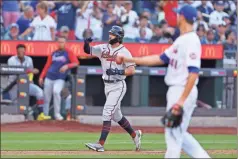  ?? ?? Below: Dansby Swanson had the Braves’ first hit off degrom with his two-run home run in the sixth.