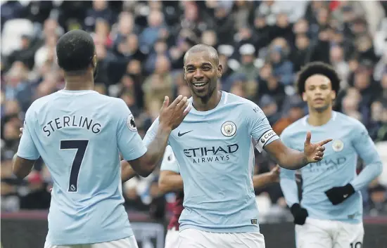  ?? Reuters ?? Fernandinh­o, centre, rejoices with his teammates as Manchester City refuse to slow down after securing the Premier League title two weeks ago