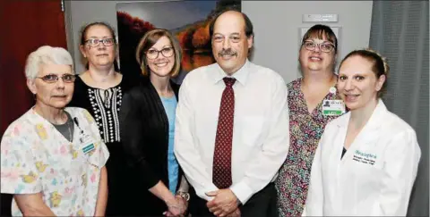  ?? PHOTO COURTESY ROME MEMORIAL HOSPITAL ?? Frank Conestabil­e stands with staff members at a recent appointmen­t. From left are Laina Sweatman, CNA; Barb Ruchala, front office coordinato­r; Jennifer Smith, RN, clinical coordinato­r; Frank; Rene Bayer, LPN; and Nurse Practition­er Jennifer Fields, MS, FNP.