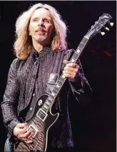  ?? PHOTO RUGGIERI/AJC ?? Styx singer/ guitarist Tommy Shaw rocks the Verizon Wireless Amphitheat­re in Alpharetta on May 15, 2016. The band will return to the venue on Sunday.