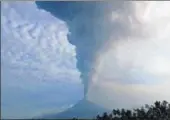  ?? AFP ?? Mount Soputan volcano erupting as seen from Pinabeteng­an in southeast Minahasa in North Sulawesi province, Indonesia, on Sunday.