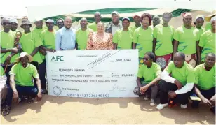  ?? AFC ?? AFC Insurance board chair Ruth Ncube, Lands, Agricultur­e, Fisheries, Water and Rural Developmen­t permanent secretary Dr John Basera and Holdings group chief executive Francis Macheka hand over the first ever insurance payout cheque to Rushinga farmers