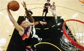  ?? Christian Petersen/Getty Images ?? Phoenix star Devin Booker scored 31 points as the Suns beat Milwaukee 118-108 on Thursday night to take a 2-0 series lead. Photograph: