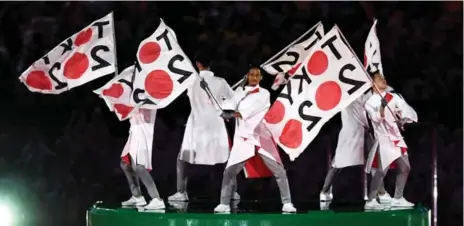  ?? DAVID RAMOS/GETTY IMAGES ?? Dancers pointed fans to the next Games, in Tokyo, at the Rio closing ceremony on Sunday. Tokyo 2020 promises new sports and new technology.