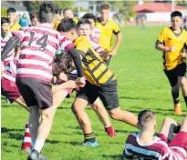  ??  ?? In the senior 12th Grade clash between Dannevirke and Taradale there was plenty of hard driving forward play and some classy back movements by both sides.