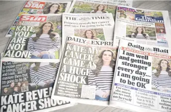  ?? — AFP file photto ?? A picture shows the front pages of some of Britain’s national newspapers, dominated by stories about Catherine announcing her cancer diagnosis, in Amersham on March 23.