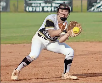  ?? Jeremy Stewart ?? Rockmart’s Sam Wolfe gets the ball after a hit by an Adairsvill­e batter during last Thursday’s doublehead­er at Rockmart High School in the Region 6-3A playoff series. The Lady Jackets will host Ringgold to determine the region’s No. 3 and No. 4 seeds in the state playoffs.