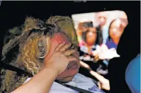  ?? ERIC GAY/ASSOCIATED PRESS ?? Grace Valencia, great aunt of shooting victim Uziyah Garcia, passes media members Sunday as she leaves after picking up a copy of the Texas House investigat­ive committee report.