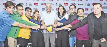  ?? ?? Tournament commission­er Mike Verano (center) is with rival coaches in a photo shoot during the launch of UAAP Season 86 volleyball tournament at the MOA Arena yesterday.