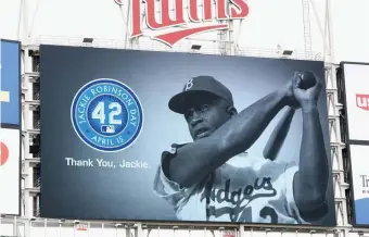  ?? GETTy iMaGES ?? PAYING RESPECTS: Players, coaches and umpires all wore No. 42 yesterday in honor of Jackie Robinson, who broke baseball’s color barrier in 1947.