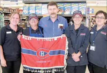  ?? SUBMITTED PHOTO ?? Tatamagouc­he Foodland owner Mike Belliveau is soon retiring from the store he’s overseen for 25 years. He has fond memories of his time there, including when an employee returned from working in Afghanista­n and brought back a Montreal Canadien flag...