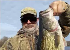  ?? Submitted photo ?? An angler who did not want to be identified caught and released an 18-inch largemouth bass on Dec. 14 at Lake Arthur on a red and white Dardevle from shore.