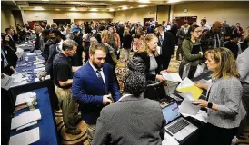  ?? MARSHALL GORBY / STAFF ?? The Holiday Inn in Fairborn bustles with job seekers on Wednesday. Greg Leingang, director of personnel for AFLCMC, said he was “pretty excited” by the large turnout, and that about 100 people had been hired by mid-day.