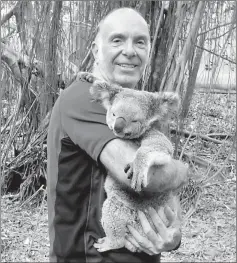  ??  ?? Cuddling a Koala Bear in Townsville, Australia.