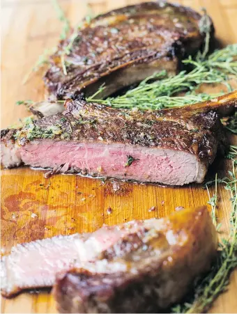  ?? — THE ASSOCIATED PRESS ?? For some people, a great steak dinner is the consummate eating experience. This ribeye steak with thyme-garlic butter qualifies as a classic restaurant-style meal at home.