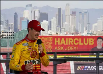  ?? ASHLEY LANDIS — THE ASSOCIATED PRESS ?? NASCAR Cup Series driver Joey Logano speaks to reporters ahead of practice sessions before a NASCAR exhibition race at Los Angeles Memorial Coliseum on Saturday.