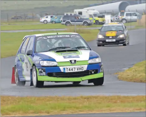  ?? 25_c29machone­130 ?? Chris Wareham and his driver Jonothan MacDonald in their Peugeot 306 at the Mach One rally earlier this year.