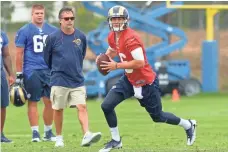  ?? JAYNE KAMIN-ONCEA, USA TODAY SPORTS ?? Rams GM Les Snead says being on a big stage “doesn’t faze” No. 1 overall pick Jared Goff, right. “He’s used to that role.”