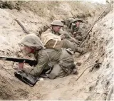  ??  ?? Men of D Company I Battalion, the Green Howards, occupy a captured German communicat­ions trench during the offensive at Anzio 22 May 1944