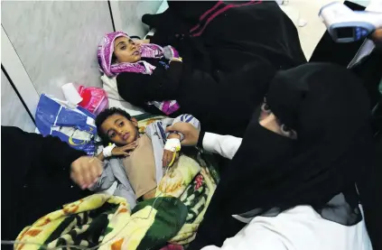  ?? Yahya Arhab / EPA ?? Yemeni children receive treatment for cholera in Sanaa. The WHO says the disease has killed dozens in recent days.