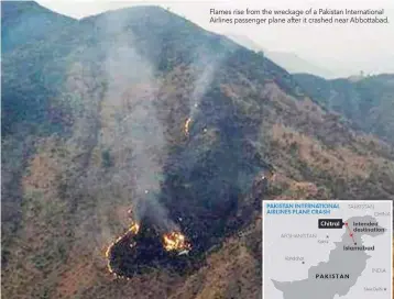  ??  ?? Flames rise from the wreckage of a Pakistan Internatio­nal Airlines passenger plane after it crashed near Abbottabad.