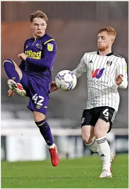  ?? ?? Derby’s young midfielder Liam Thompson on the ball and challenged by Fulham’s Harrison Reed.