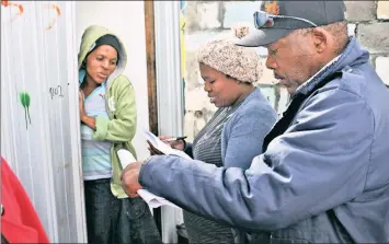  ?? PHOTO: WILLEM LAW ?? Community members working with the Community Organisati­on Resource Centre conduct a census of who is living in these newly-built housing units in the Western Cape. As African statistici­ans we have led and participat­ed fully in the discourse of Agenda...