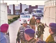  ?? KULBIR BEERA/ HT ?? Security personnel and income tax officials at the house of SGPC member Dayal Singh at Kolianwali village in Lambi constituen­cy on Wednesday.