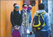  ?? (AP/Fernando Llano) ?? Students wait in line to enter a public school Monday as the new school year begins in Mexico City.