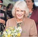  ?? ALASTAIR GRANT/AP ?? Queen Camilla visits a women’s refuge in Swindon, England, last month. Her role may change with Charles’ illness.