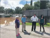  ?? Molly Hennessy-Fiske Los Angeles Times ?? THE HOME of Irineo Reyes, second from left, and his wife, Mary, left, was flooded in Richmond, Texas. They had no insurance and lost everything, they said.